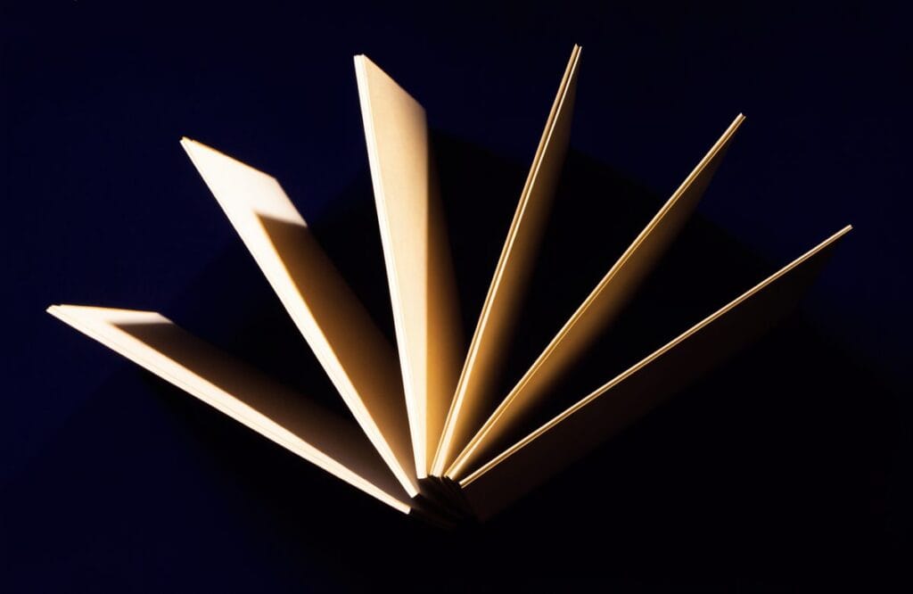 Five document folders fanned out like diverging paths and edge-lit in gold, representing the different law entrance exam routes in India.
